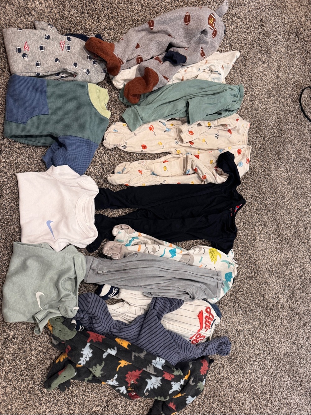 14 piece NB bundle. 2 Magnetic Jammies. 2 Nike shirts. 2 rompers. And 8 pjs